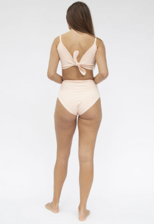 Back shot of straight size model in Two-Way Top and High-Waisted Bikini Bottoms in Petal Pink Rib.