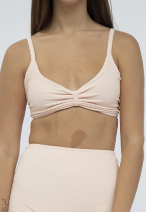 Front shot of straight size model in Skinny Knot Top and High-Waisted Bottoms in Petal Pink Rib.