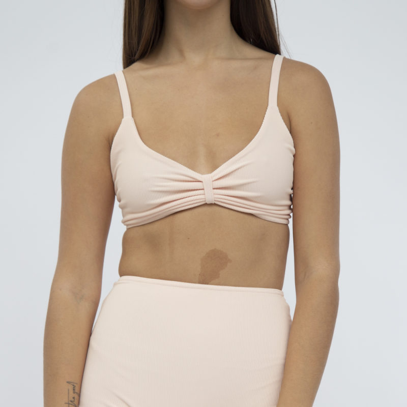 Front shot of straight size model in Skinny Knot Top and High-Waisted Bottoms in Petal Pink Rib.