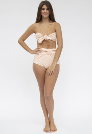 Front shot of straight size model in Bandeau Tie Top Top and Twist High-Waisted Bottoms in Petal Pink Rib.