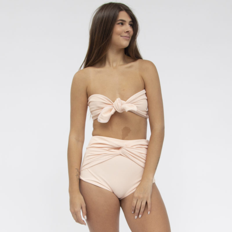 Front shot of straight size model in Bandeau Tie Top Top and Twist High-Waisted Bottoms in Petal Pink Rib.
