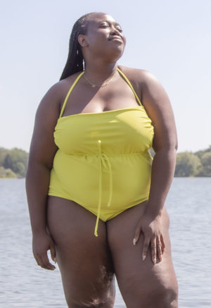 Front view of plus size model in Margarita Rib Straightaway One Piece standing in lake.