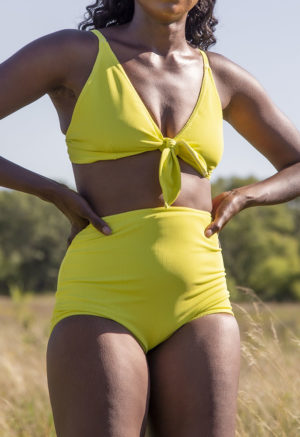 Front view of straight size model in Margarita Rib Retro Fit Bottoms standing in grass.