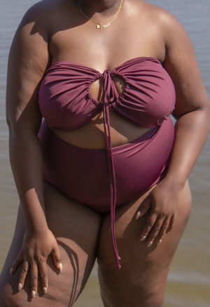 Front view of plus size model in Fig Retro Fit Bottoms standing in lake.