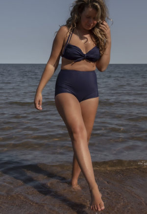 Front view of straight size model in Indigo Rib Retro Fit Bottoms standing in lake.