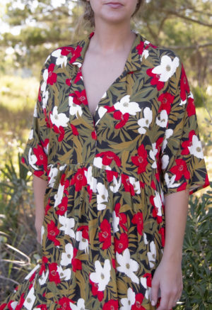 Close-up front view of straight size model wearing Island Floral Tiered Lapel Dress.