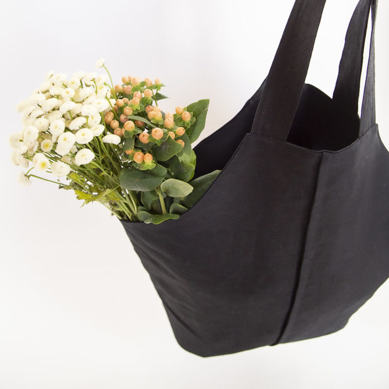 Black Baguette Tote with flowers.