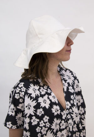 Side view of straight size model wearing White Sun Hat.