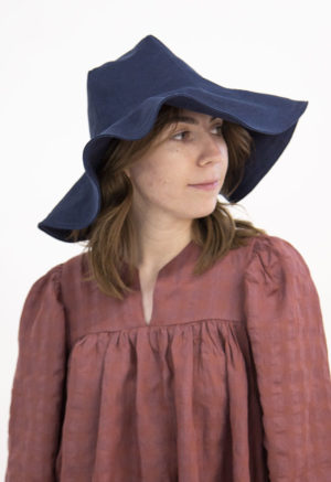 Front view of straight size model wearing Navy Sun Hat.