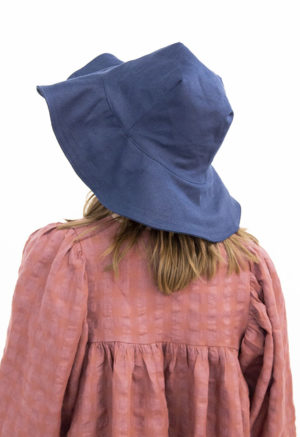 Back view of straight size model wearing Navy Sun Hat.