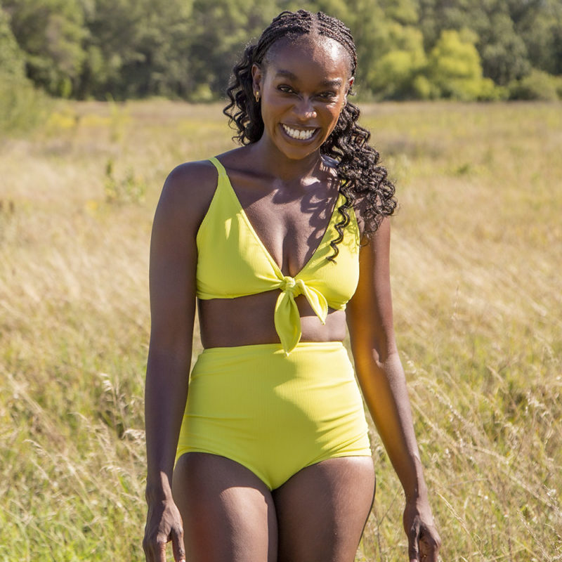 Front view of straight size model wearing Margarita Tear Drop Tie Top and Retro Fit Bottoms standing in field.