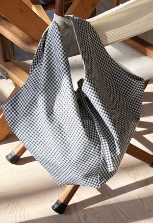 Dark Teal Blue Gingham Everyday Tote hanging on chair