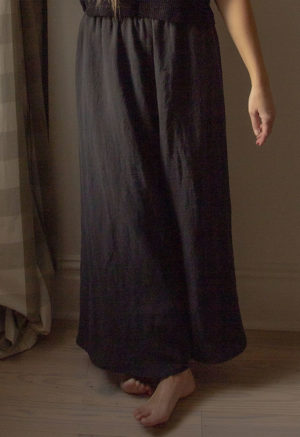 Close-up front view of straight size model wearing Black Linen Extra Wide-Leg Pants.