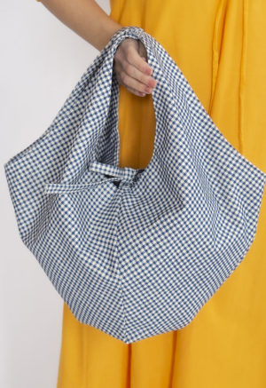 Straight size model holding Dark Teal Blue Gingham Everyday Tote.