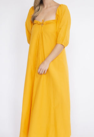 Front view of straight size model wearing Gold Keyhole Maxi Dress.
