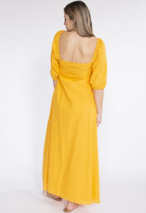 Back view of straight size model wearing Gold Keyhole Maxi Dress.