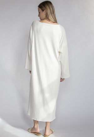 Back view of straight size model wearing Ivory Rib Reversible Long Sleeve Maxi Dress.