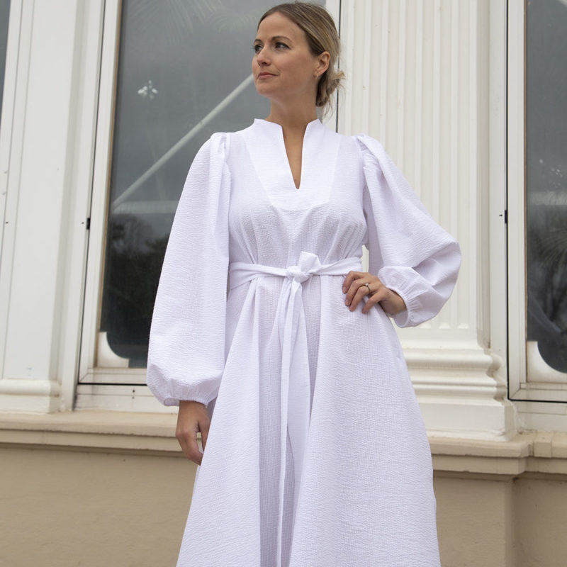 Front view of straight size model wearing White Seersucker High Collar Dress.
