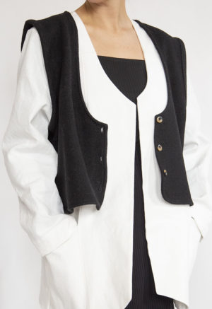 Front view of straight size model wearing Black Wool Vest.