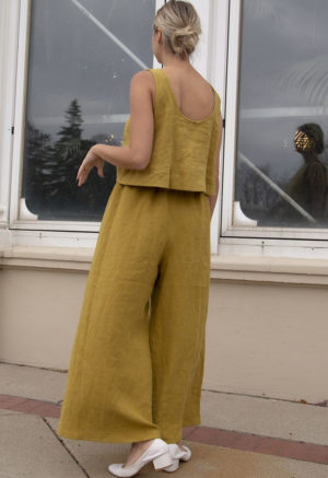 Back view of straight size model wearing Avocado Linen Extra Wide-Leg Pants.