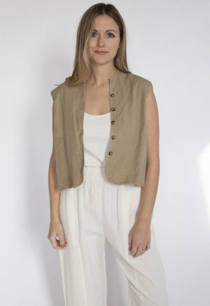 Front view of straight size model wearing Nomad Button Vest.