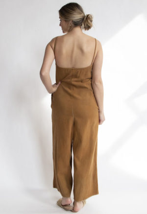 Back view of straight size model wearing Toffee Spaghetti Strap Jumpsuit.