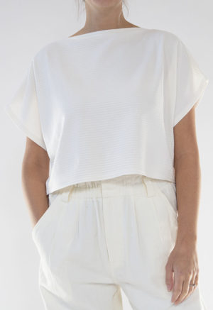 Front view of straight size model wearing Ivory Rib Cropped Rib Boatneck Top.