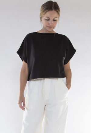 Front view of straight size model wearing Black Rib Cropped Rib Boatneck Top.
