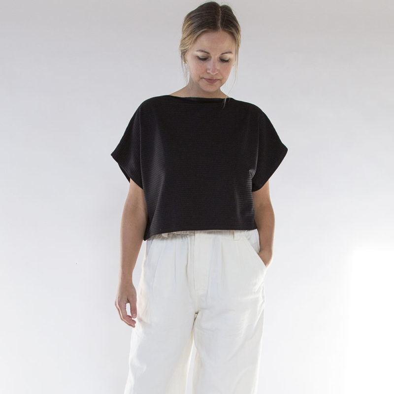 Front view of straight size model wearing Black Rib Cropped Rib Boatneck Top.