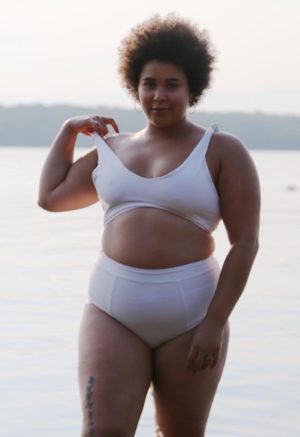 Front view of plus size model wearing White Shoulder Tie Top.
