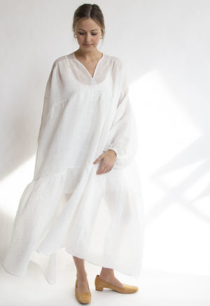Front view of straight size model wearing White Limited-Run Double V Tiered Maxi Dress.
