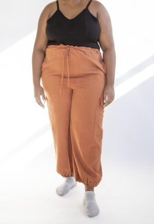 Front view of plus size model wearing Cinnamon Drawstring Cargo Pants.