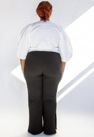 Back view of plus size model wearing White Puff-Sleeve Button-Down.