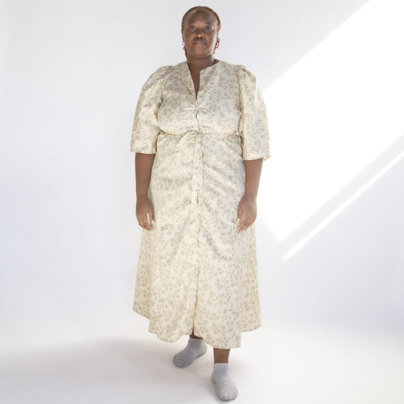 Front view of plus size model wearing Almond Floral Button-Down Dress.