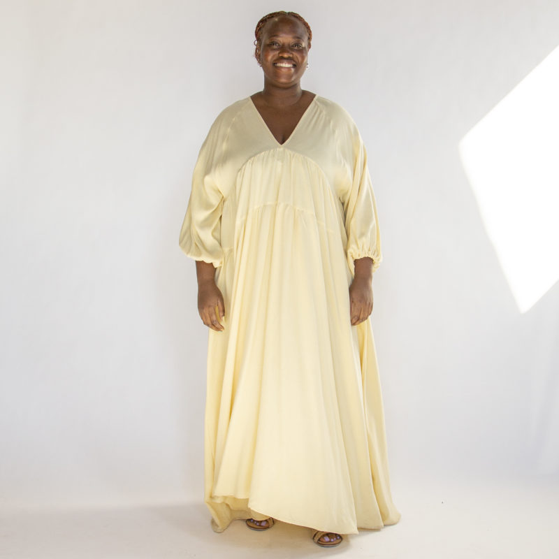 Front view of plus size model wearing Italian Straw V-Neck Maxi Dress.
