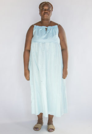 Front view of plus size model wearing Capri Blue Reversible Tie Dress.