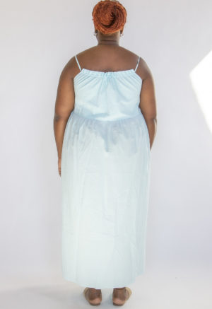 Back view of plus size model wearing Capri Blue Reversible Tie Dress.