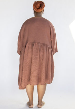 Back view of plus size model wearing Raising Cotton Short Oversized Dress.