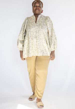 Front view of plus size model wearing Almond Floral Balloon Sleeve Tunic.