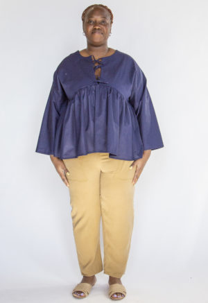 Front view of plus size model wearing Navy Reversible Tie Tunic.