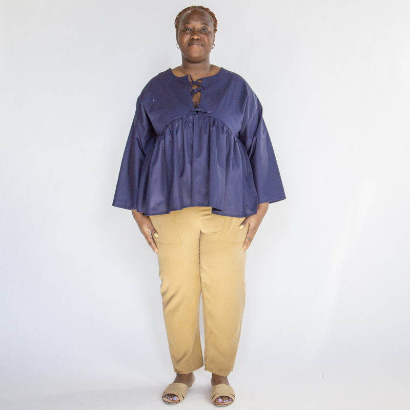 Front view of plus size model wearing Navy Reversible Tie Tunic.