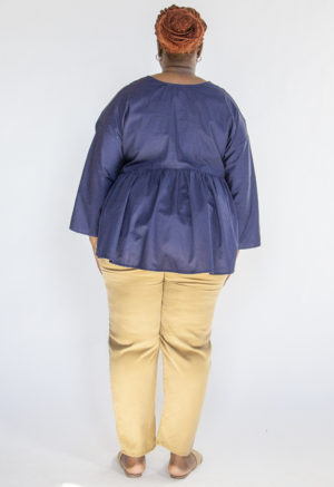 Back view of plus size model wearing Camel Easy Tapered Pant.