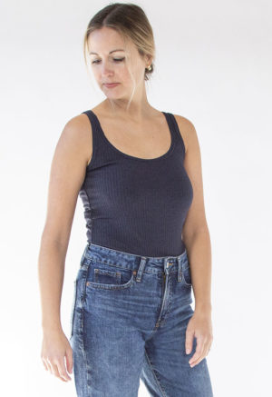 Front view of straight size model wearing Navy Rib Reversible Scoop Bodysuit.