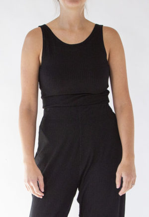 Front view of straight size model wearing Black Rib Reversible Scoop Bodysuit.