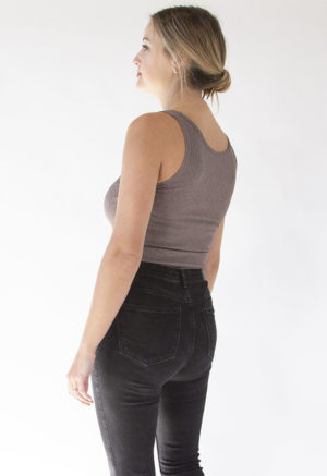 Back/side view of straight size model wearing Mauve Rib Reversible Scoop Bodysuit.