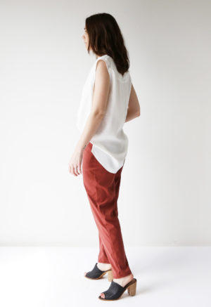 Side view of straight size model wearing Brick Satchel Pants.
