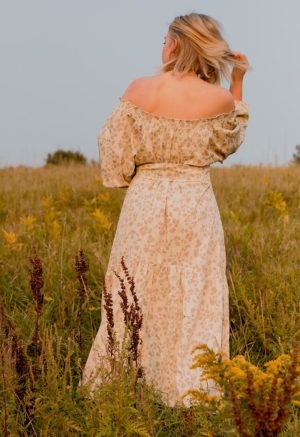 Back view of straight size model wearing Almond Floral Pauline Maxi Dress.