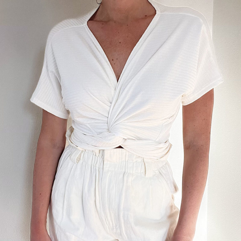 Front view of straight size model wearing Ivory Short-Sleeve Everything Top.