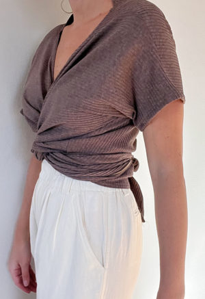 Front/side view of straight size model wearing Mauve Short-Sleeve Everything Top.