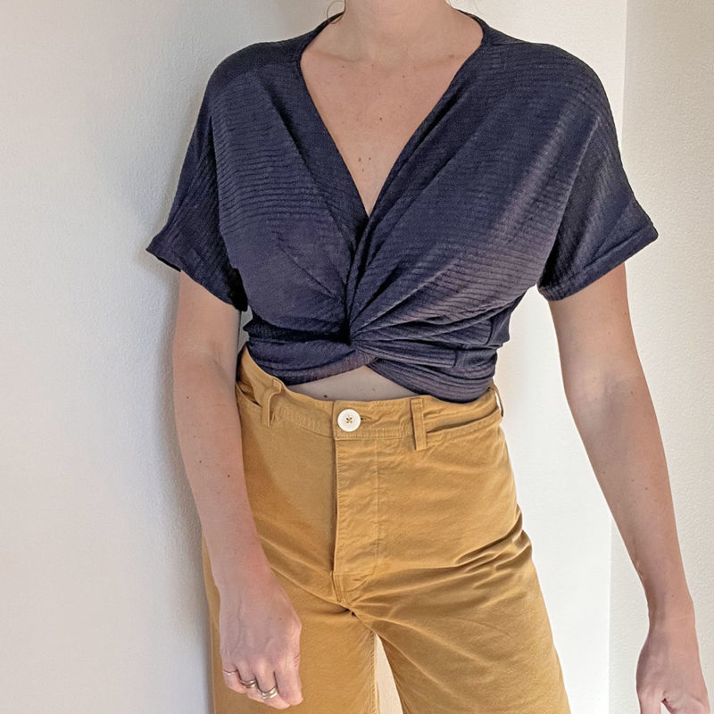 Front view of straight size model wearing Navy Short-Sleeve Everything Top.